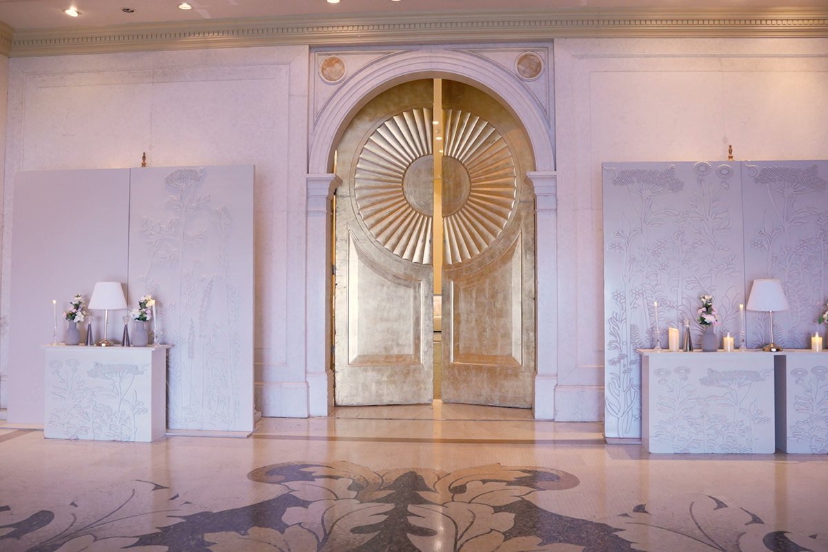 Entrance doors of a banquet hall dressed for a wedding
